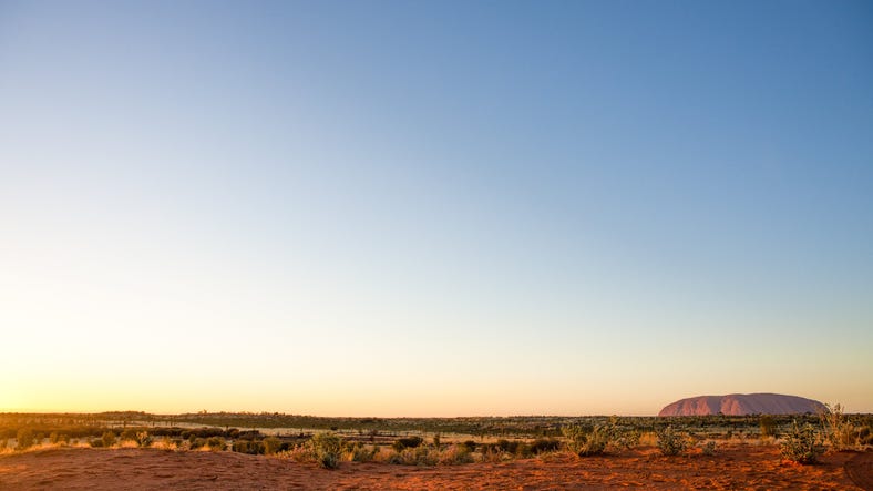 Landscape view of Uluru at sunrise