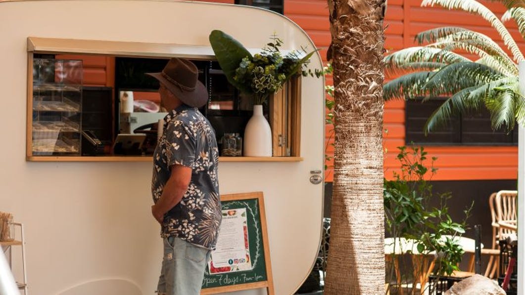 Man ordering food at the Black Russian Caravan Bar in Katherine