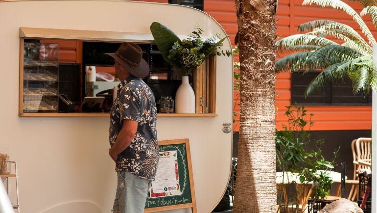 Man ordering food at the Black Russian Caravan Bar in Katherine