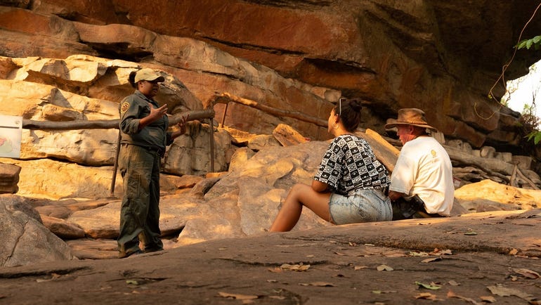 Steve and Morgan listening to a tour guide explain aborginal culture