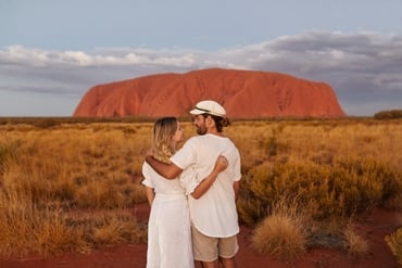 Couple standing together near Uluru