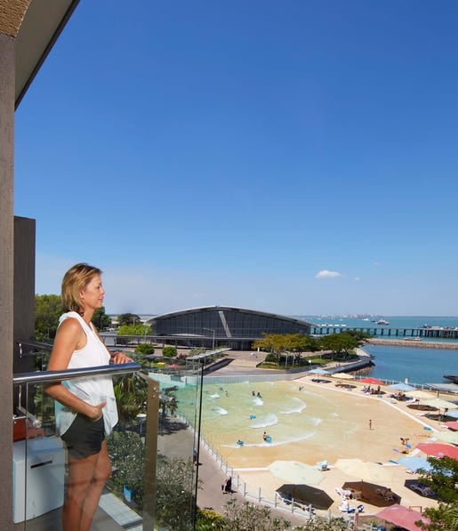 Lady on balcony Adina Vibe Hotel Apartments Darwin
