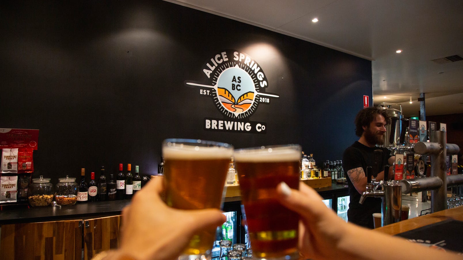 Toasting with two beers at the Alice Springs Brewery