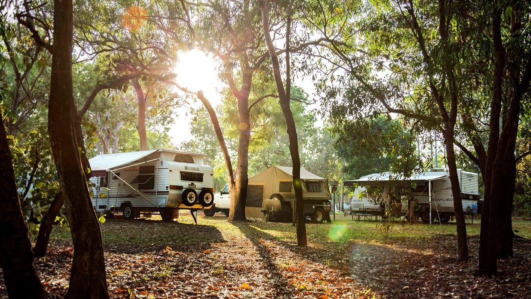 Caravans Camping under the trees at Cooinda lodge