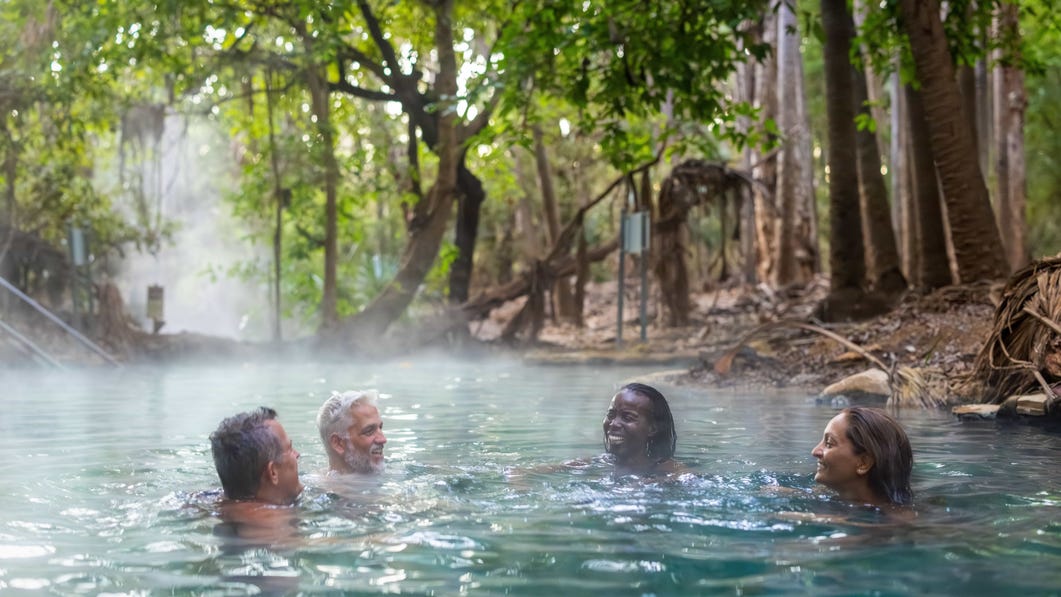Group relaxing in Mataranka Thermal Pool