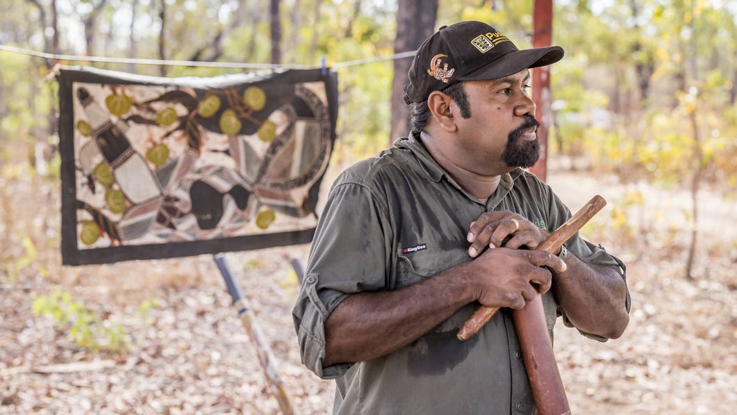 Aboriginal guide with didgeridoo