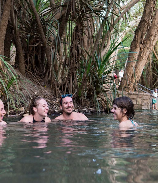 Friends swimming together at Katherine Hot Springs