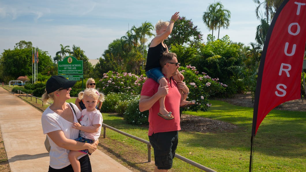 A family walking to the School of the Air attraction in Katherine