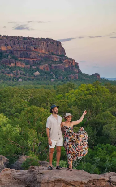 Couple standing on a rock surface at Nawurlandja lookout