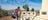 Older couple looking at the monument at Anzac Hill in Alice Springs