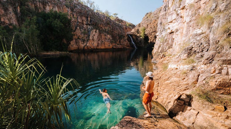 Two men swimming at Maguk