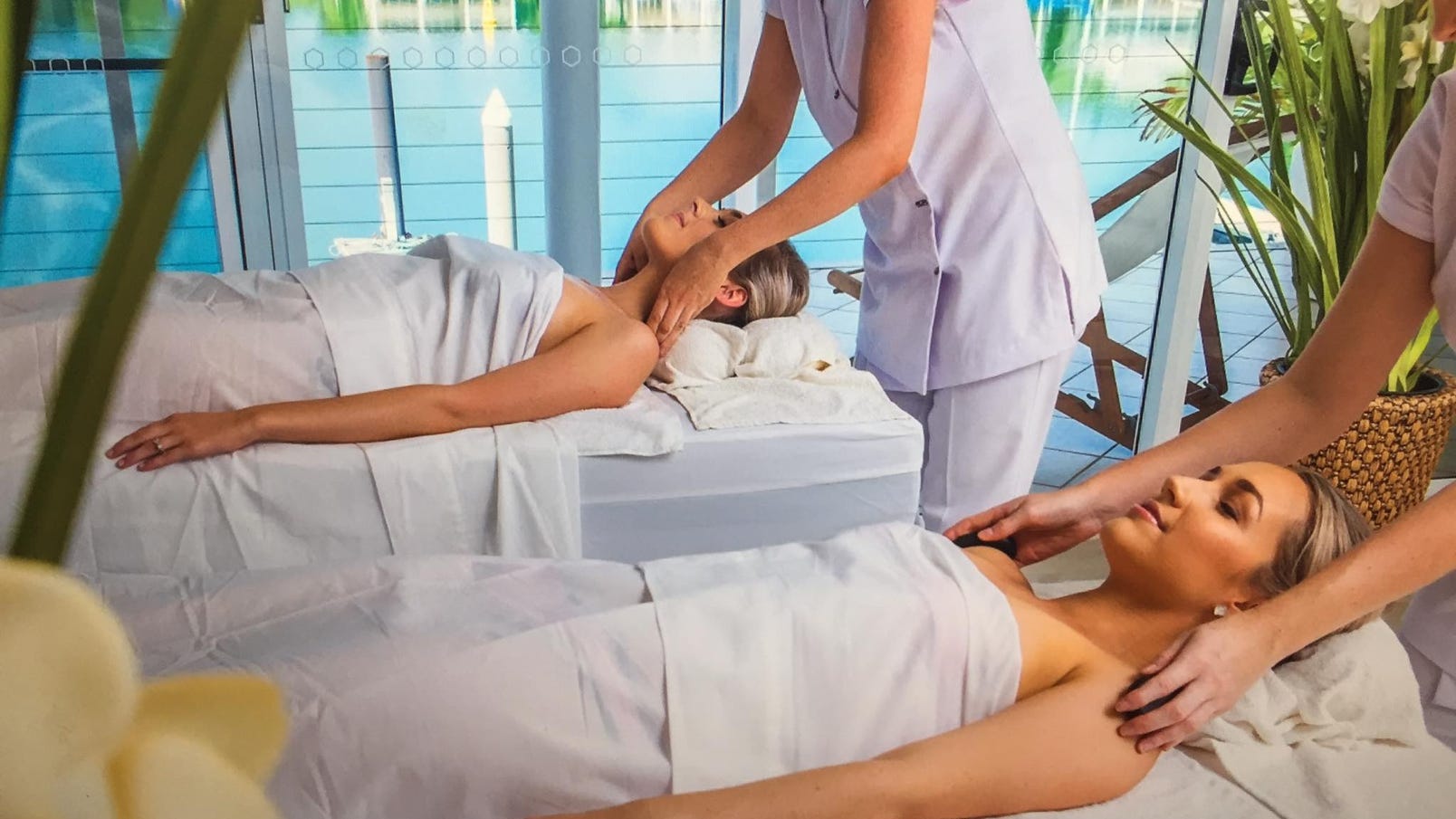 two-females-receiving-shoulder-massages-at-cullen-bay-day-spa-overlooking-the-marina,-d-,jpg