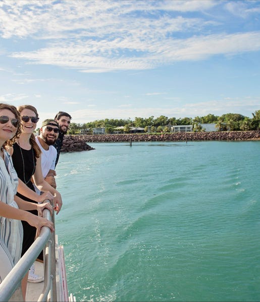 Group of people looking off the rail on the sealink Darwin Harbour Sightseeing Cruise