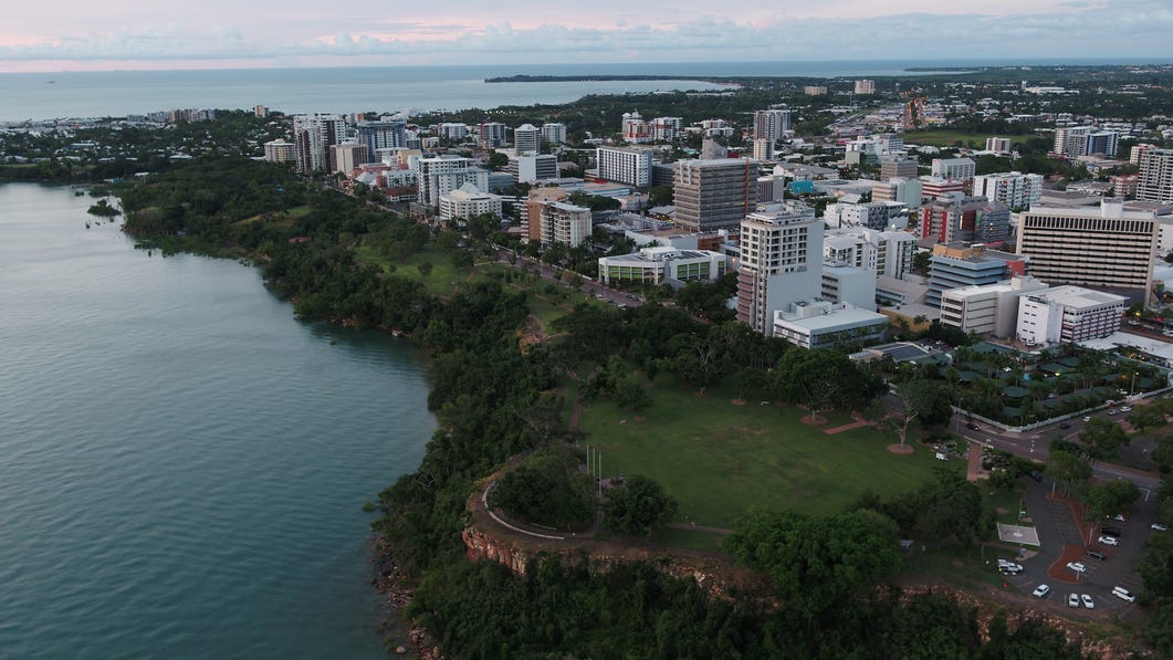 aerial-view-of-bicentennial-park-with-city-in-background-and-ocean-in-foreground,-d-,jpg