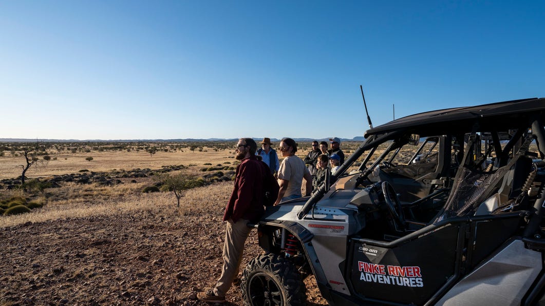 A Finke River Adventures group looking out over the national park