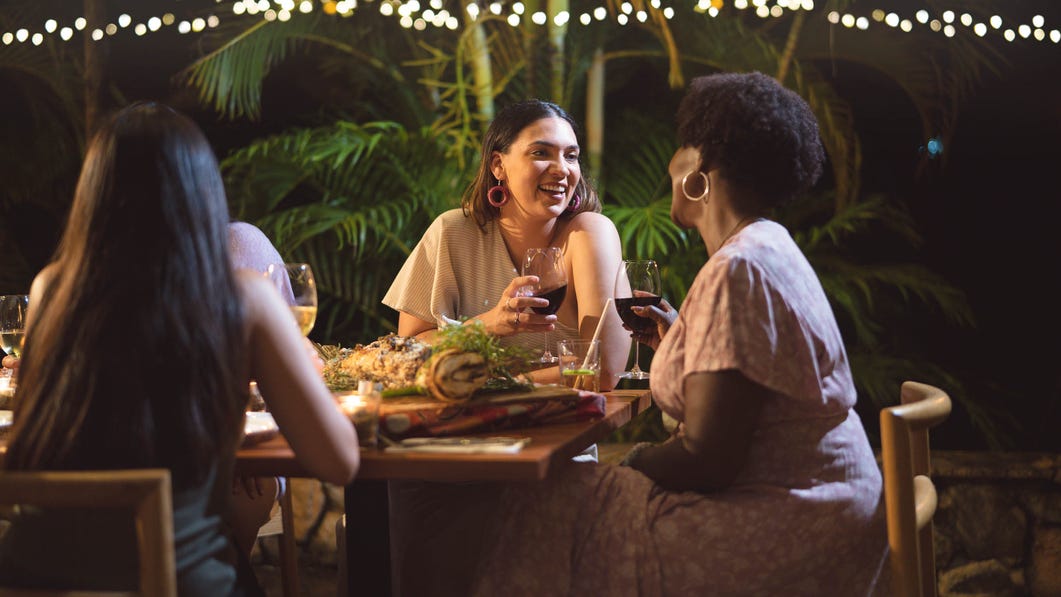 girlfriends having dinner at cooinda lodge in kakadu national park
