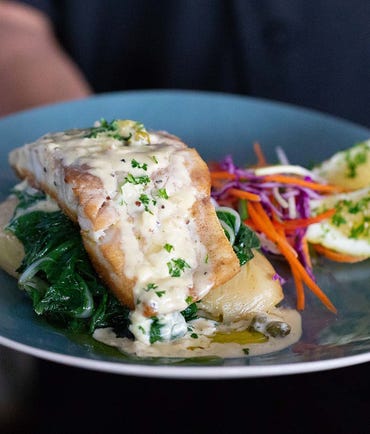 salmon dish at yots greek taverna at cullen bay marine