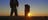 Two people hiking on the Larapinta Trail at Sunrise