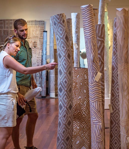 Couple looking at aboriginal art at Buku Larrnggay Mulka Arts Centre