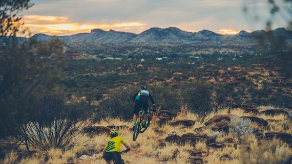 two mountain bikers taking in views near alice springs,-d-,jpg