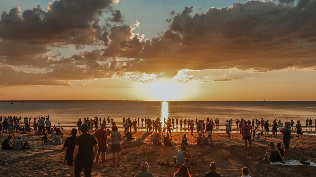 Crowds of people enjoying the sunset at the Mindil Beach Sunset Markets