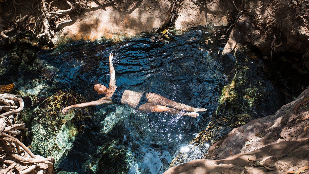 girl floating at katherine hot springs,-d-,jpg