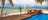 two women relaxing and having a refreshing drink on a deck at tiwi island retreat,-d-,jpg