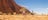 Couple on a bike ride around the base of Uluru